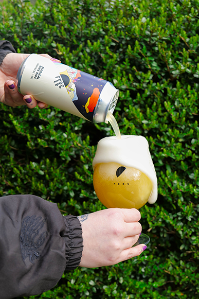A brighter, extra pale ale being poured into a glass
