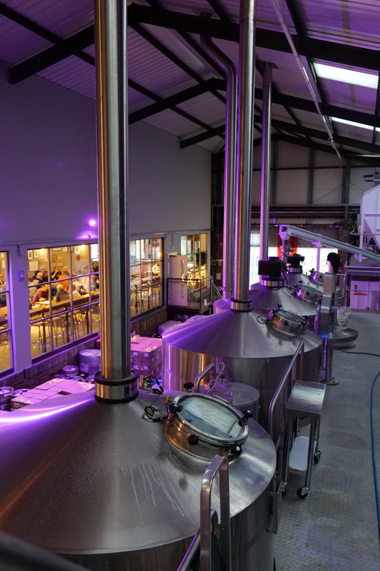 Multiple rectangular gift cards with a printed image of a brewery interior and text 'BREWERY TOUR'.