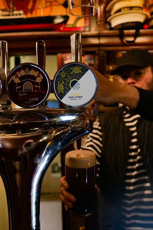 Dark Horse from Full Circle pouring on draught at the crown pasada