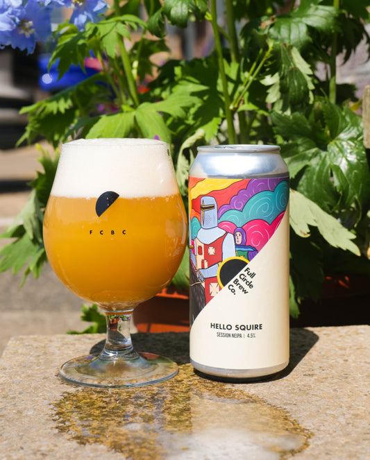 New beer hello squire in a glass next to it's can 