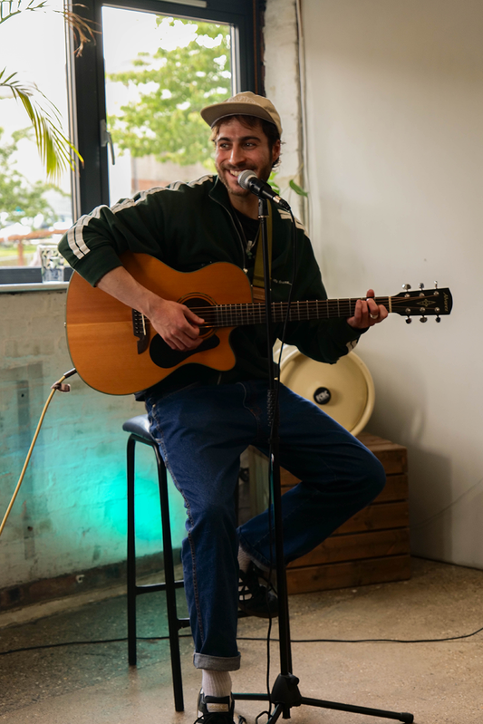 a man playing a guitar 