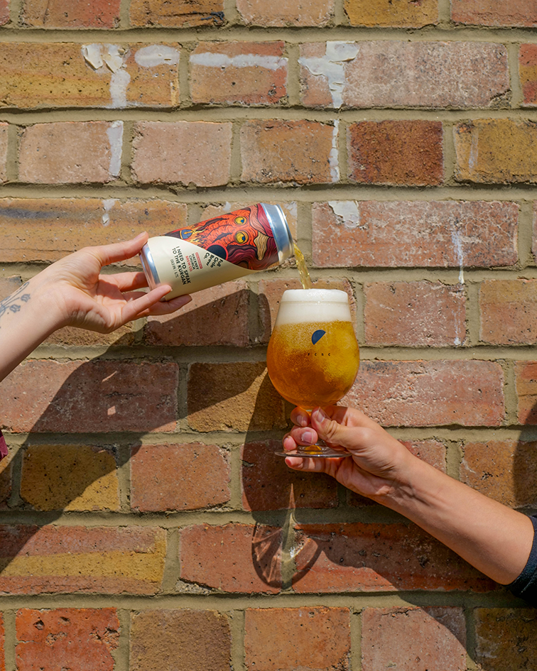 A can of our new Cold IPA being poured into a schooner 