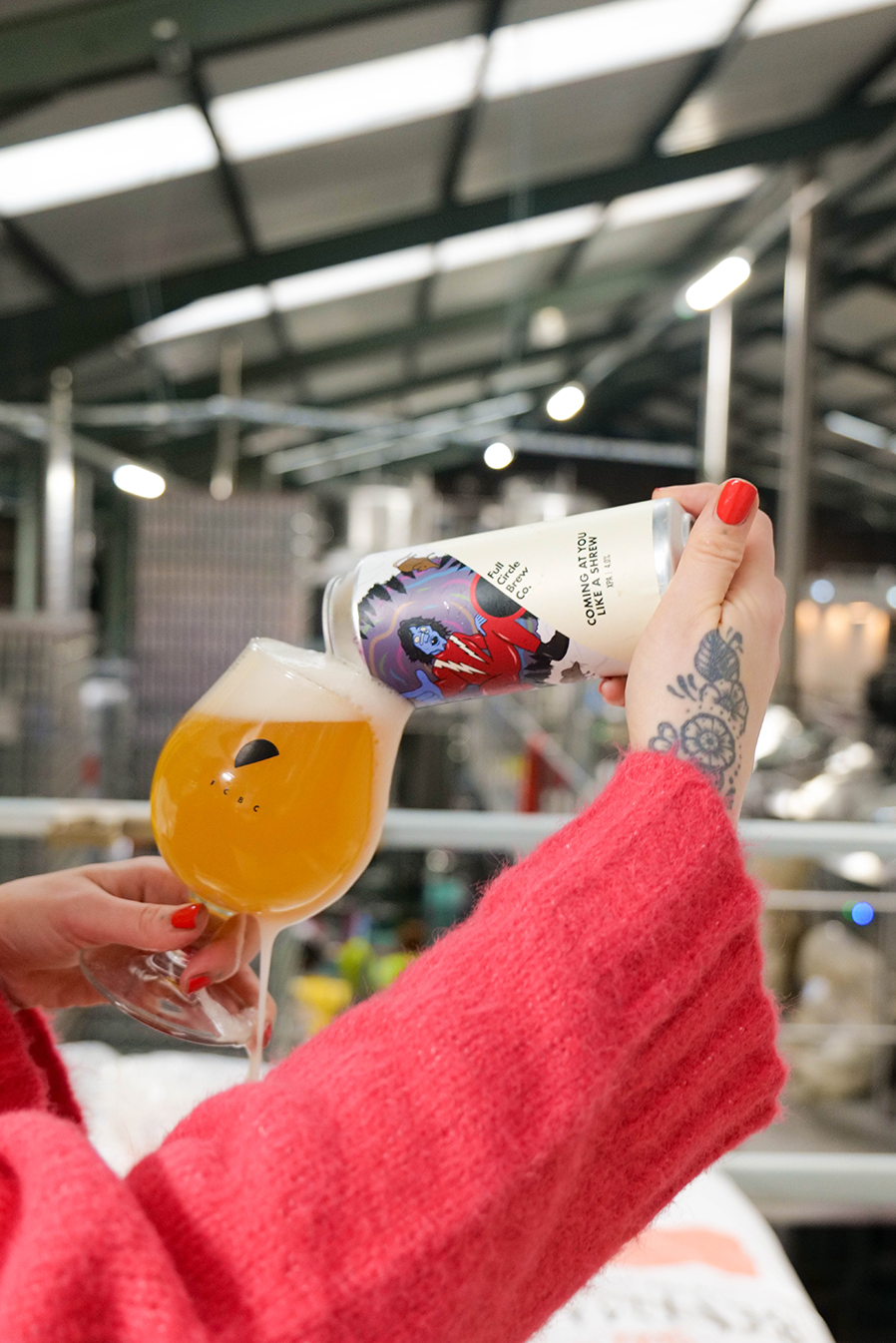 A can of an XPA called 'Coming at you like a shrew' being poured into a schooner glass in Full Circle Brewery